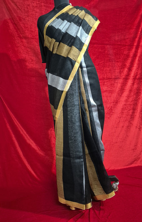 Handloom pure linen saree in black with gold and silver zari border, draped on mannequin